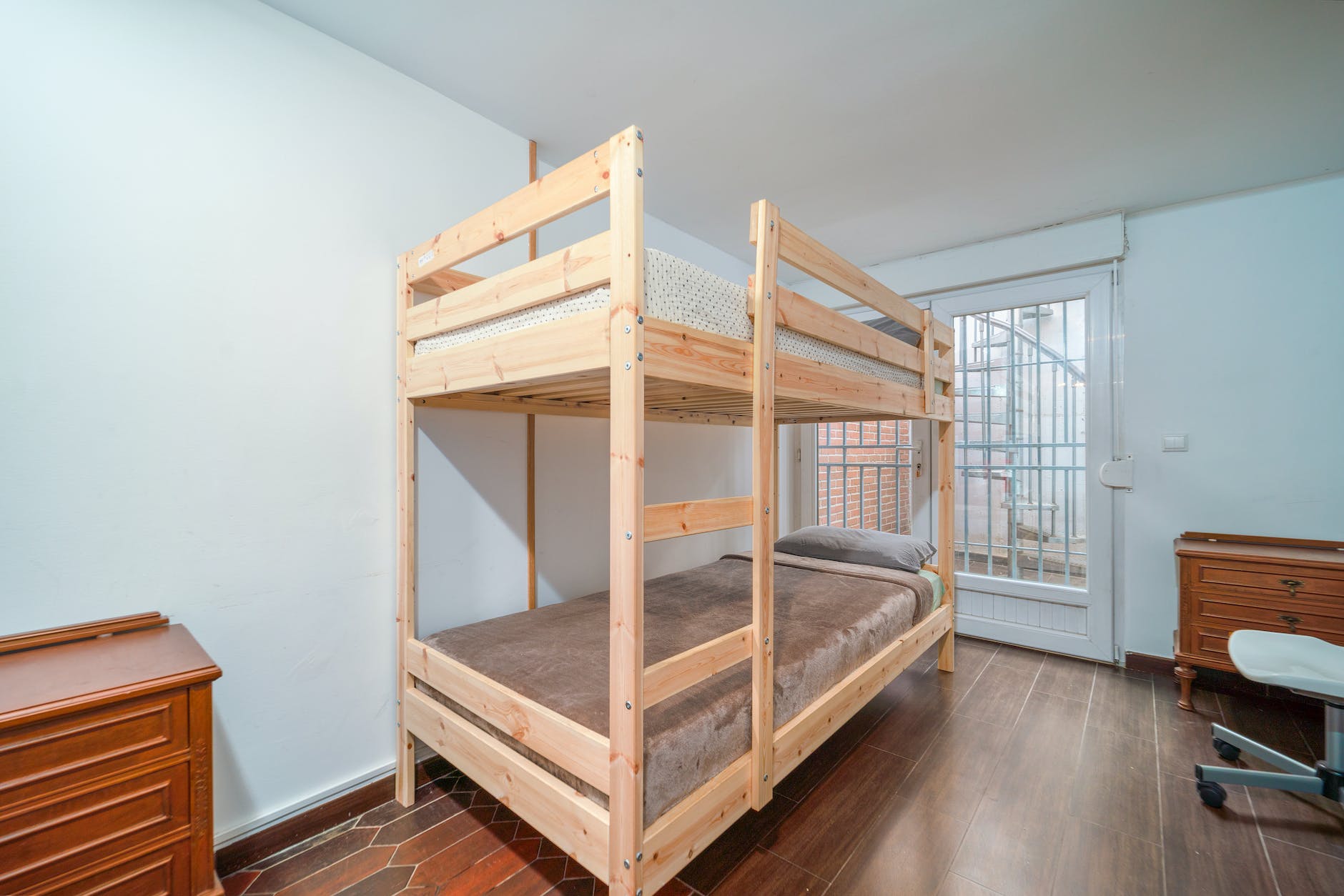 wooden bunk bed inside the room